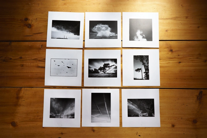 black and white prints layed out on floor
